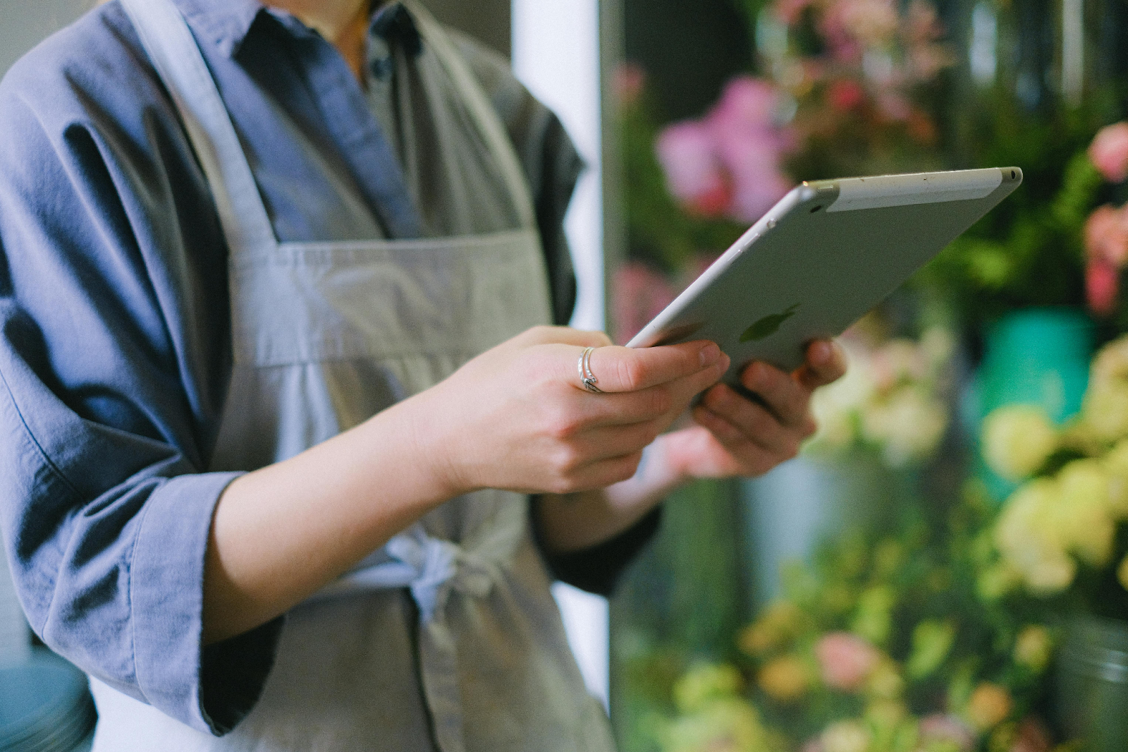Restaurant staff member using a digital tablet
