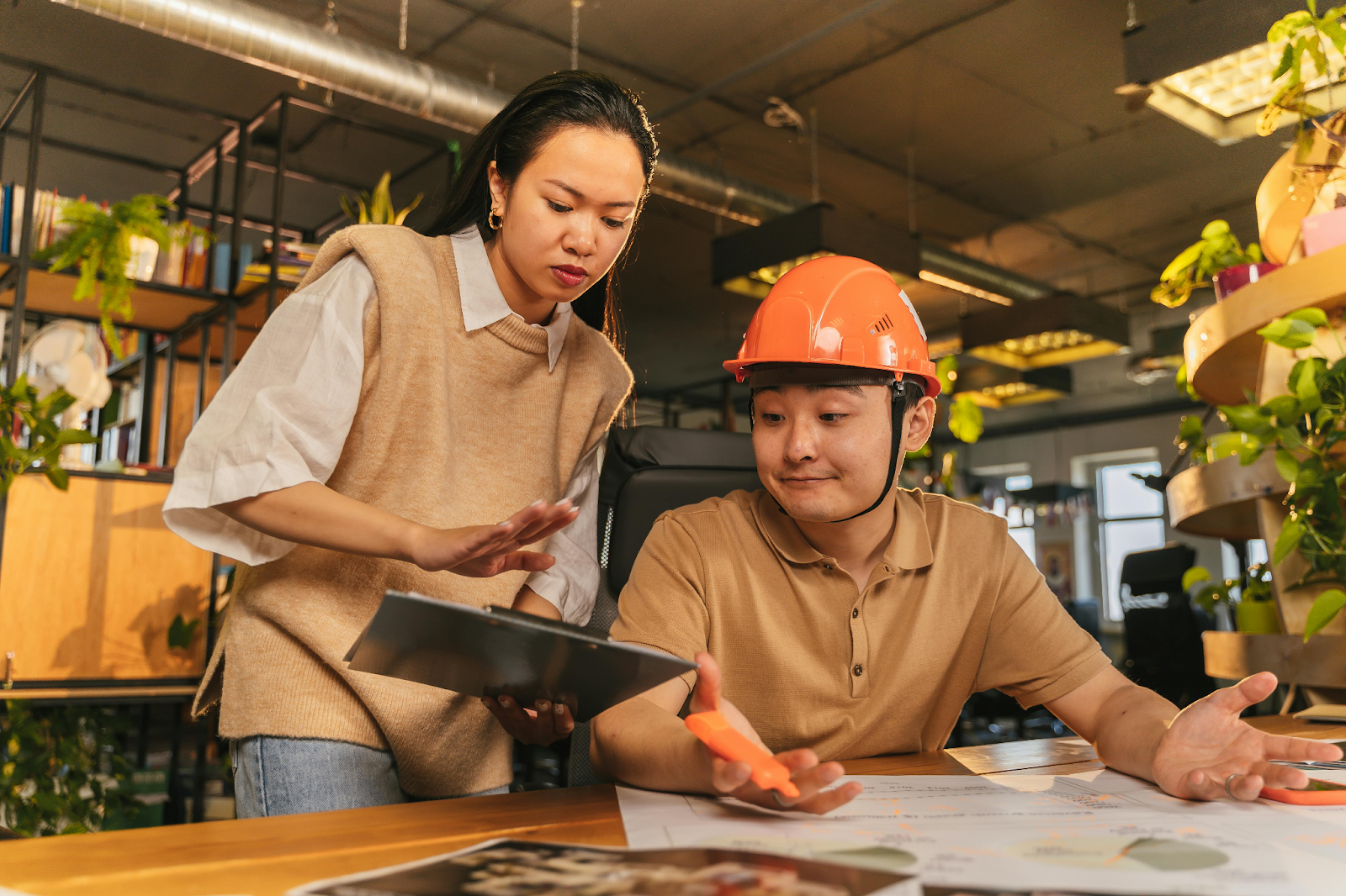 Professionals discussing construction documents