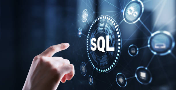 Hand pointing at holographic SQL interface with connected technology icons on a blue digital background